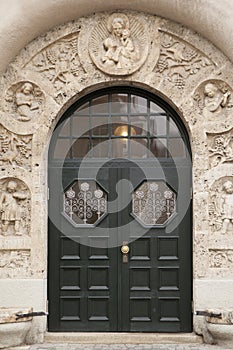 Old green wooden doors on an antique european building