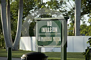 Old green wooden No invasion sign photo