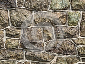 Old grey natural stone wall