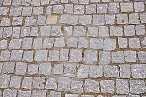 Old grey pavement in a pattern in an old medieval european town.