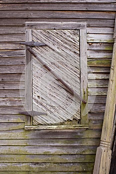 Old greying bare wood siding and window photo