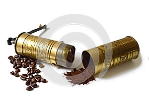 Old grinder, coffee beans and ground coffee