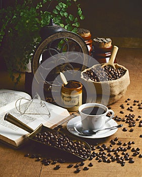 Old grinder and cup of coffee