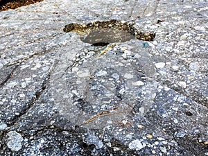 Old, Grooved and Pitted Grindstone photo