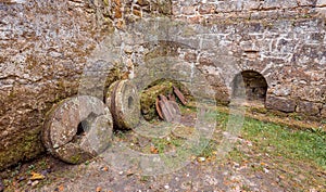 Old ground mill in the woods photo