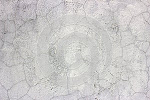 Old grunge dirty cracked vintage light gray concrete and cement mold texture wall or floor background with weathered paint