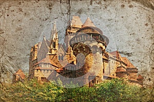 Old grunge image of medieval Kreuzenstein castle in Leobendorf village photo