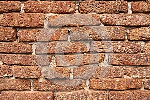 Old grunge laterite brick wall texture for background