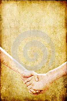 Old grunge paper background with hands holding