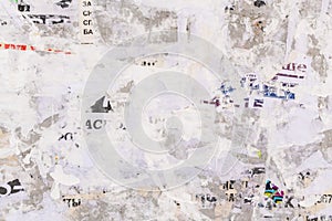 Old grunge ripped torn vintage collage street posters creased crumpled paper surface placard texture background backdrop