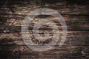 Old grunge rustic dark scratched wood texture background. Text space, empty template