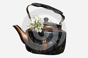 Old grunge soot vintage teapot with white flowers