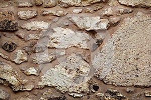 Old grunge stone wall texture, material, pattern wallpaper and background, close up. Natural contrast masonry rock wall granite.