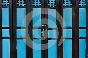 Old grunge and weathered blue wood door background and texture