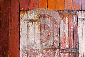 Old grunge and weathered red and white wooden wall planks texture background