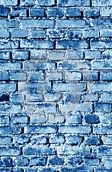 Old grungy brick wall surface in navy blue tone