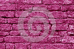 Old grungy brick wall texture in pink tone