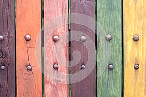 Old grungy Colorful fence with nails close up