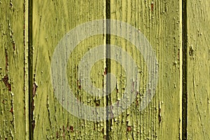 Old grungy green wood wall. Green painted wooden wall plank frame as simple saturated green peeling paint timber old grungy photo