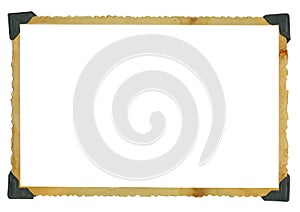 Old grungy photo frame,empty photograph with photo corners,isolated on white background, free space for pics