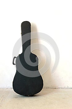 The Old Guitar case on wall