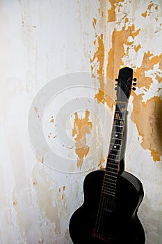 Old guitar in the dirty grunge room