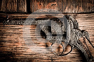 Old gun on wooden table