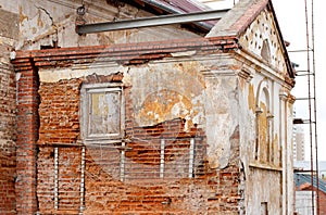 Old gungy wall with immured window