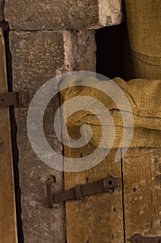 Old gunnysack hanging on a barn door