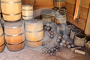 Old gunpowder barrels and cannonballs