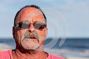 Old Guy on the Beach with Sunglasses