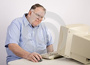 Old Guy at computer grimacing