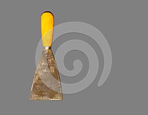 old gyan putty or spatula isolated on gray background, hand tool for construction, look old and dirty.