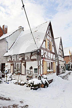 Old Half-Timbered House In Snowy Village, Germany