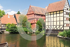 Old half timbered houses reflected in lake