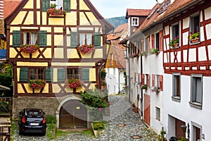 Old half-timbered houses in South Germany. Beautiful typical houses in German village. Vintage narrow street in summer