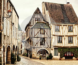 Old half-timbered houses on Town Hall Square of Noyers Noyers-sur-Serein.   Noyers is beautiful medieval French village  in Burg