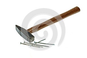 Old hammer with nail isolated on white