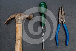 Old hammer screwdriver and pliers DIY tools