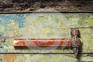 Old hammer on wood background