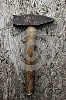 Old hammer with wooden handle