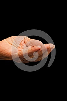 The old hand begging on the black