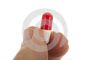 Old hand with capsule pill