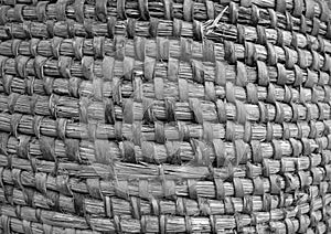 Old hand crafted basket made from dry grass in black and white