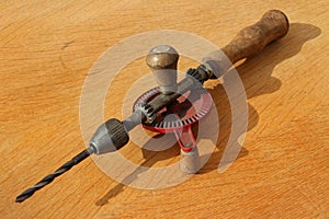 Old hand drill with drill bit