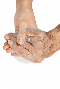 Old hand holding young hand