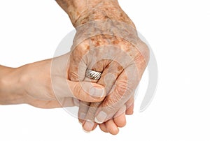 Old hand holding young hand