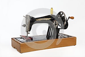 An old, hand sewing machine. Isolated, on white background.