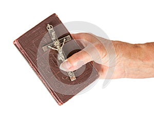 Old hand (woman) holding a very old bible