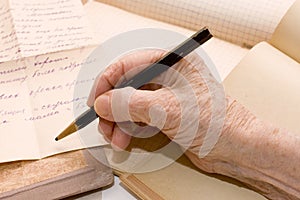 Old hand writes the letter photo